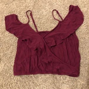 Cross crop top snaps in the middle.